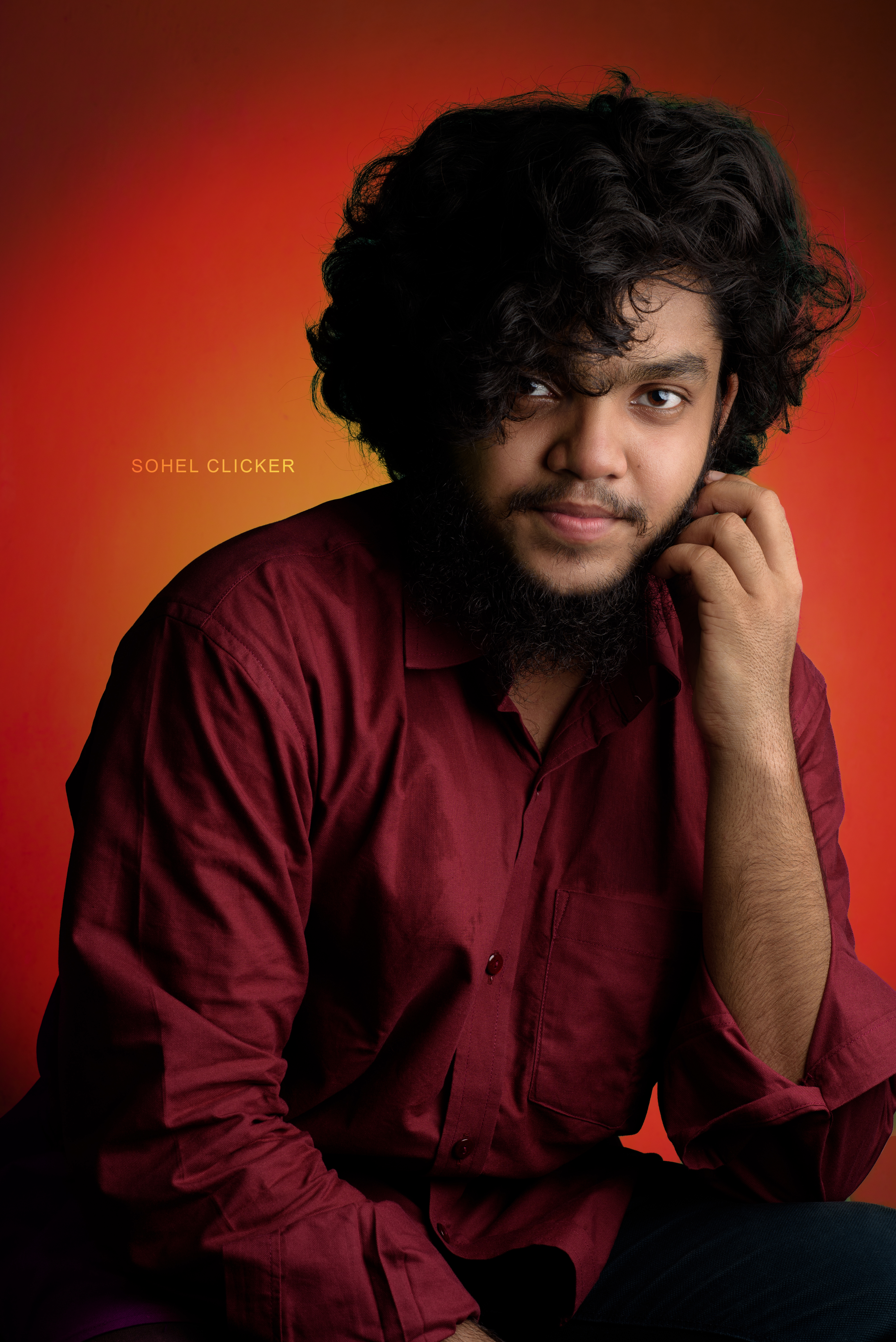 Professional photographer in maroon shirt